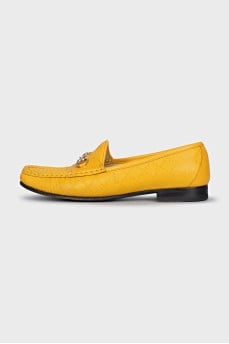 Yellow loafers with gold decor