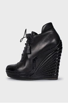 Black ankle boots with perforated leather