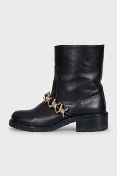 Leather boots with gold-tone decor on the front