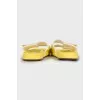 Yellow suede flip flops