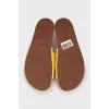 Yellow suede flip flops