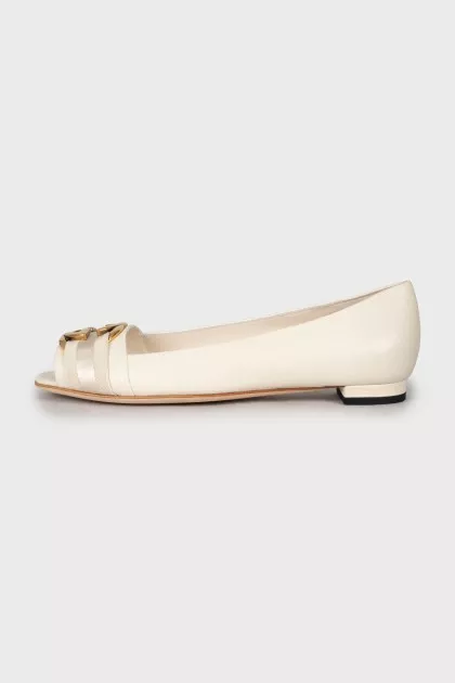 White ballerinas with golden logo