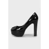 Patent leather shoes with embossed print