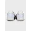 White sneakers with leather inserts