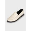 White leather loafers
