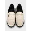 White leather loafers