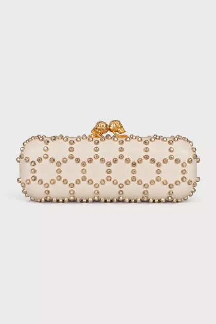 Leather clutch with golden skulls
