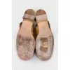 Gold colored shoes with suede toe