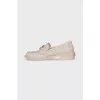 Beige loafers with metal logo