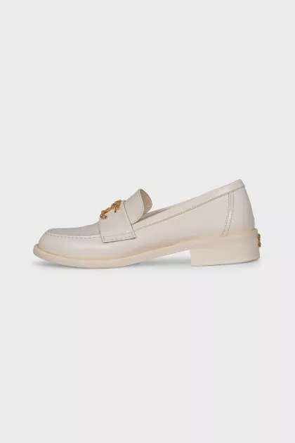 Beige loafers with metal logo