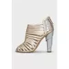 Golden shoes with figured heels