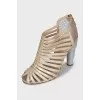 Golden shoes with figured heels