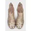 Golden shoes with figured heels