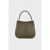 Green bag with golden logo