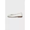 Leather ballet flats decorated with a bow