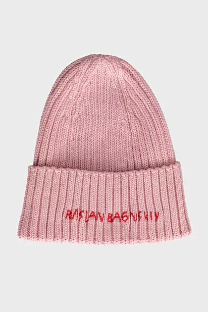 Knitted pink hat with embroidery