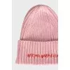 Knitted pink hat with embroidery