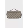 Bag with signature print on chain