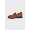 Brown loafers with gold decor