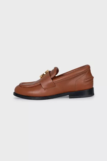 Brown loafers with gold decor
