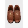 Brown loafers with gold decor