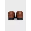 Brown loafers with gold decor