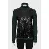 Green sweater with patent leather element