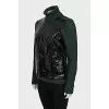 Green sweater with patent leather element