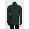 Green sweater with patent leather element
