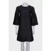 Straight cut dress decorated with frills