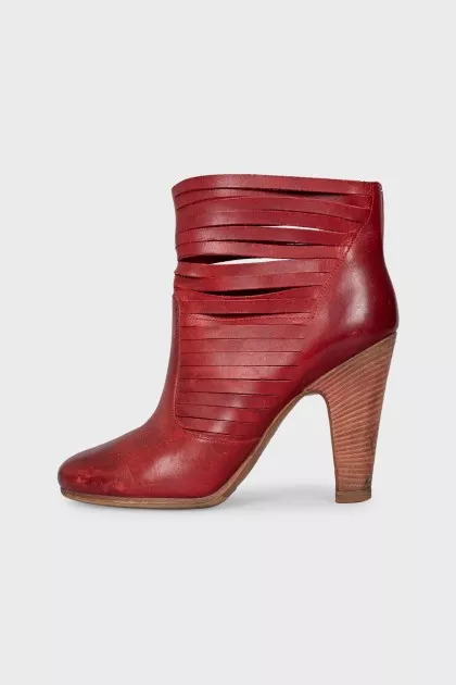 Red leather ankle boots with perforation