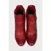 Red leather ankle boots with perforation