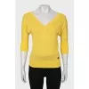 Yellow pullover with a cutout on the back