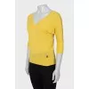 Yellow pullover with a cutout on the back