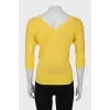 Yellow pullover with a cutout on the back