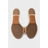 Beige leather flip flops