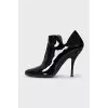 Patent leather ankle boots with textile back
