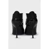 Patent leather ankle boots with textile back