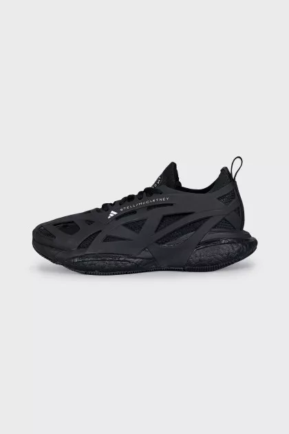Black sneakers made of rubber and textile