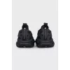 Black sneakers made of rubber and textile