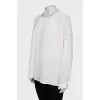 Loose-fitting blouse with a button