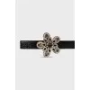 Leather belt with a buckle decorated with crystals
