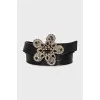 Leather belt with a buckle decorated with crystals