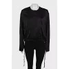 Black bomber jacket with a zipper and buttons