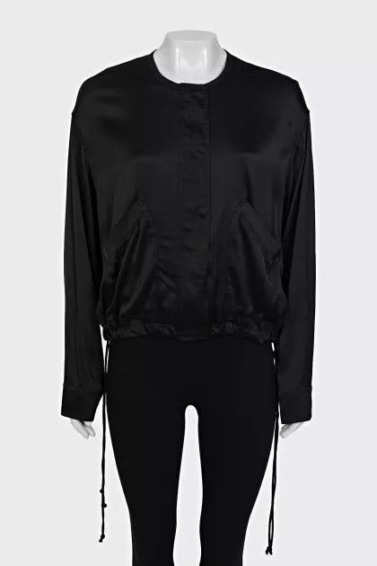 Black bomber jacket with a zipper and buttons