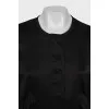 Black bomber jacket with a zipper and buttons