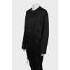 Black bomber jacket with a zipper and buttons