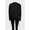 Black bomber jacket with a zipper and buttons