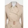 Beige trench coat with plaid lining