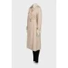 Beige trench coat with plaid lining